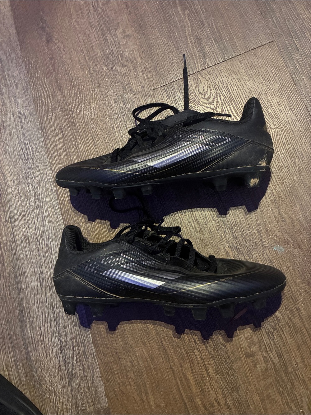 ADIDAS BLACK AND GOLD SOCCER CLEATS